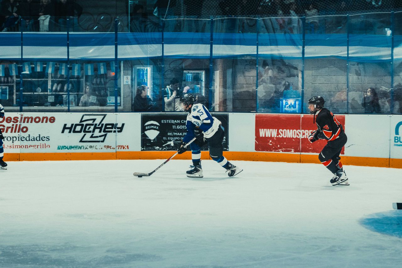 Dynamic action shot of an ice hockey game in Buenos Aires. Captured during a thrilling match.